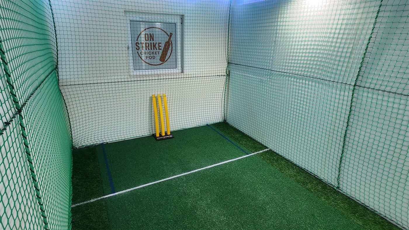 Astroturf wicket and flexible stumps in the indoor cricket pod Astroturf wicket and flexible stumps in the indoor cricket pod