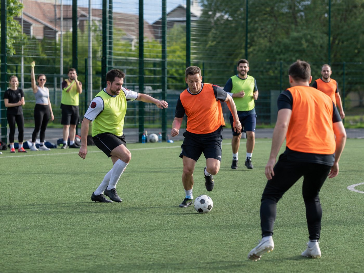 Colleagues playing in a corporate football tournament