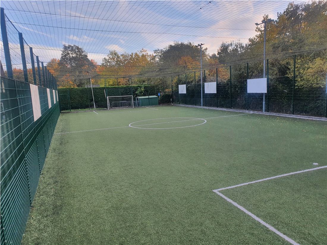Enclosed 3G football pitch at Willen Lake during autumn Enclosed 3G football pitch at Willen Lake during autumn